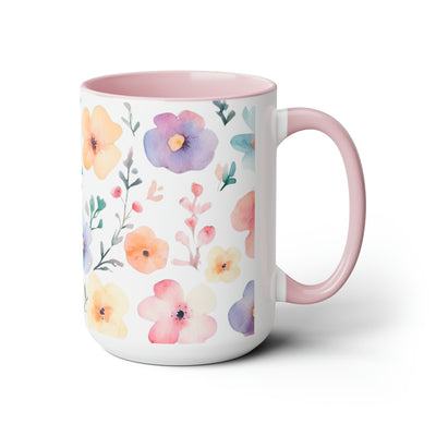 15 oz Two-Toned Mug with Pink Interior and Handle, Glossy Finish. Pastel Watercolor Style Floral Print in Light Violet, Light Oranges, and Pinks with Green Leaves on a White Background. Left Side View