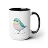 15 oz Two-Toned Mug with Black Interior and Handle, Glossy Finish, Colorful Light Aqua Blue, Light Yellow, and Light Pink Pastel Standing Bird Design in Watercolor Style. Right View with a Small Brand Name at the Bottom Left Side of the Mug