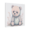 24x24" in .75" depth canvas with a cuddly bear with big round eyes and smiling in colors peach, and bluish peach gray with peach colored leaves on the background design side view