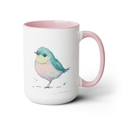 15 oz Two-Toned Mug with Pink Interior and Handle, Glossy Finish, Colorful Light Aqua Blue, Light Yellow, and Light Pink Pastel Standing Bird Design in Watercolor Style. Left side View with a Small Brand Name at the Bottom Left Side of the Mug