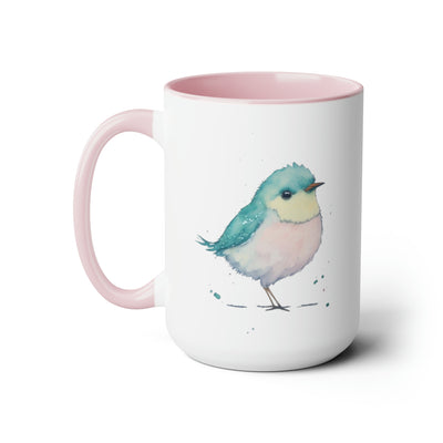 15 oz two toned mug with pink interior and handle with glossy finish in  colorful light aqua blue, light yellow and light pink pastel of a standing  bird design in water color style left  view