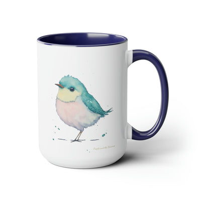 15 oz Two-Toned Mug with Blue Interior and Handle, Glossy Finish, Colorful Light Aqua Blue, Light Yellow, and Light Pink Pastel Standing Bird Design in Watercolor Style. Right View with a Small Brand Name at the Bottom Left Side of the Mug